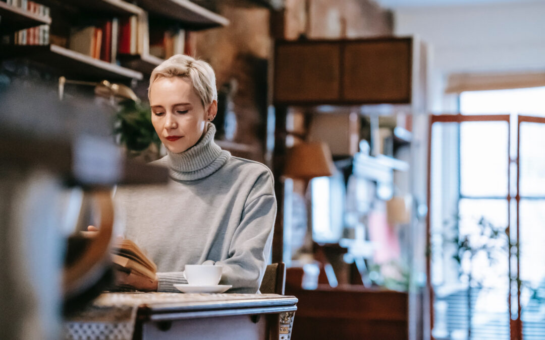 A woman reading studying at a Tea shop